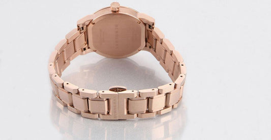Rose gold stainless steel case back with link bracelet visible