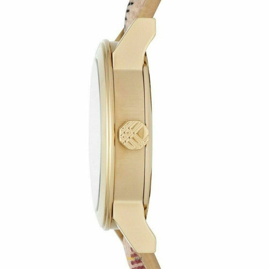 Side profile of Burberry The City watch showing gold-tone case and beige patterned leather band