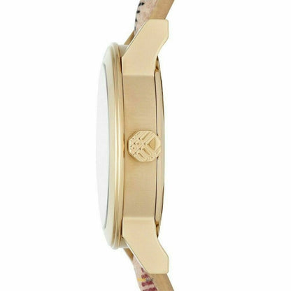 Side profile of Burberry The City watch showing gold-tone case and beige patterned leather band