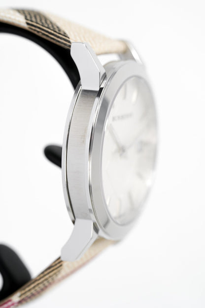 Side view of Burberry women's watch showing silver case profile and fabric strap