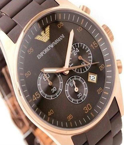 Close-up of brown dial with Emporio Armani logo, chronograph subdials, and rose gold hands