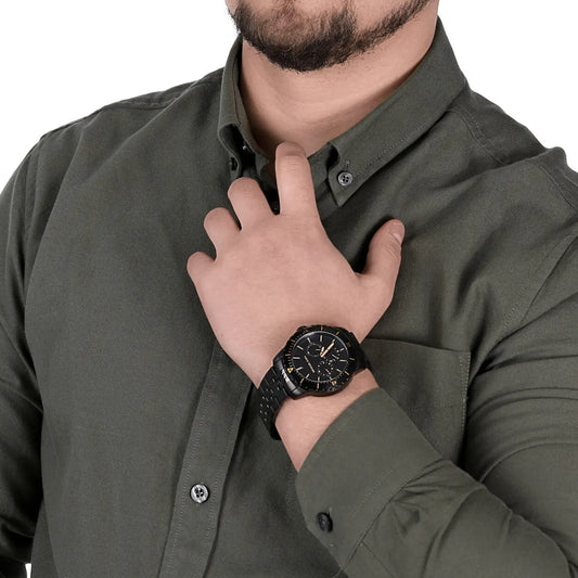 Michael Kors Cunningham MK7157 watch worn on men's wrist showing black dial and chronograph function